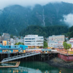 RD, Radiance of the Seas, Juneau, Alaska, cityscape, scenic, town, port, buildings, signage, mountains, forest, trees, clouds in background,